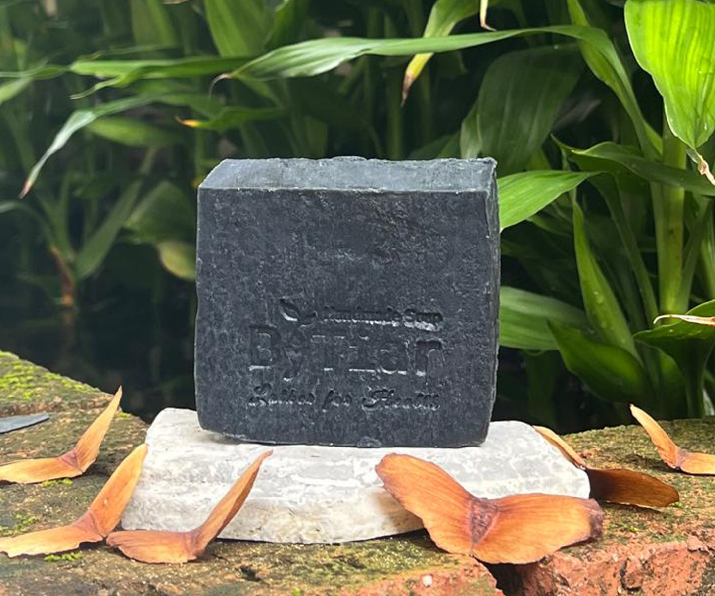 ByTiar Handmade Cold-Processed Black Lion Scrub Soap with activated charcoal for detoxification and gentle exfoliation.